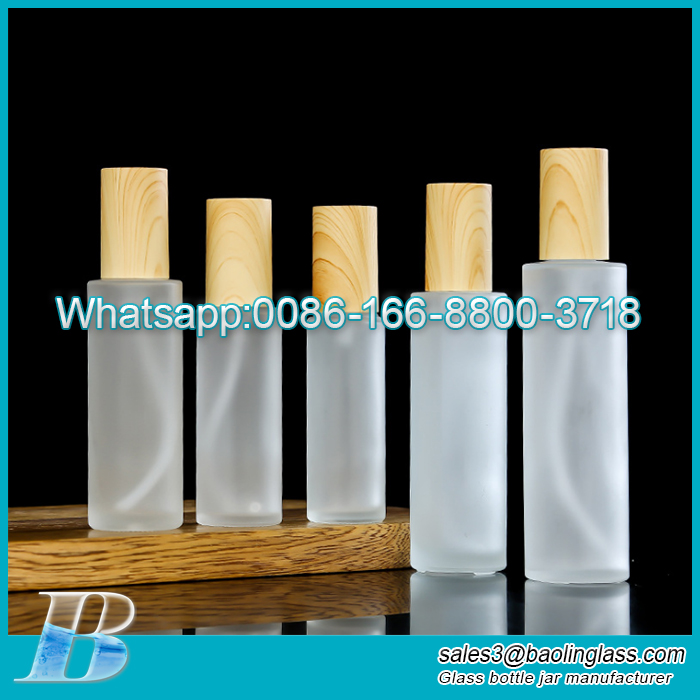 Frosted wholesale glass spray bottle for cosmetic essential oil bottle with wooden grain cap