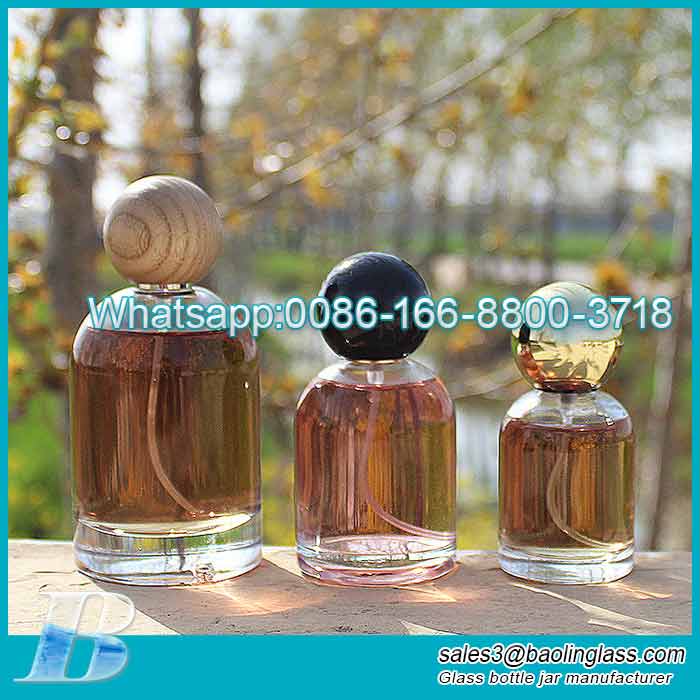 Venta al por mayor 30ml50ml botella de perfume de vidrio transparente botella de spray 100ml botella de perfume vacía con tapa de bola
