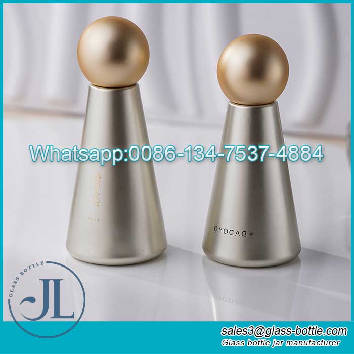 Customized tapered electroplated glass cosmetic bottle with ball cap